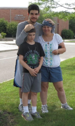A young Joshua with his brother and mother.