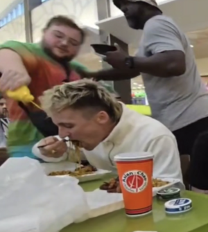 Tony Bame getting doused in mustard by "Mustard Man"