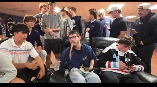 Professor Block vomiting on the floor of a frat house.